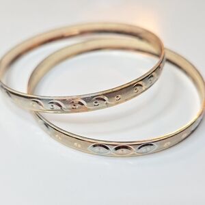 Matching pair of etched bangle bracelets in Elegant Gold and Silver Jewelry Set